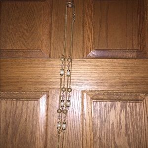 Gold, and faux pearl layered necklace.